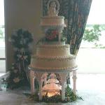 buttercream iced cake using fresh flowers and Wilton's Gazebo kit (no longer available) serving 150