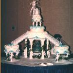 Buttercream iced using silk ivy and cherub stands (no longer available) and heart shaped satellite cakes serving 150