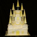 Buttercream icing with brick details and fondant turrets and trim.  
