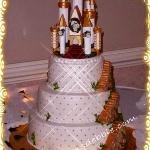 Buttercream icing with a trellis effect and gold dragees .  The is a castle topper decorated by the bride and placed on top of my cake, stairways  around the sides are all cake. 